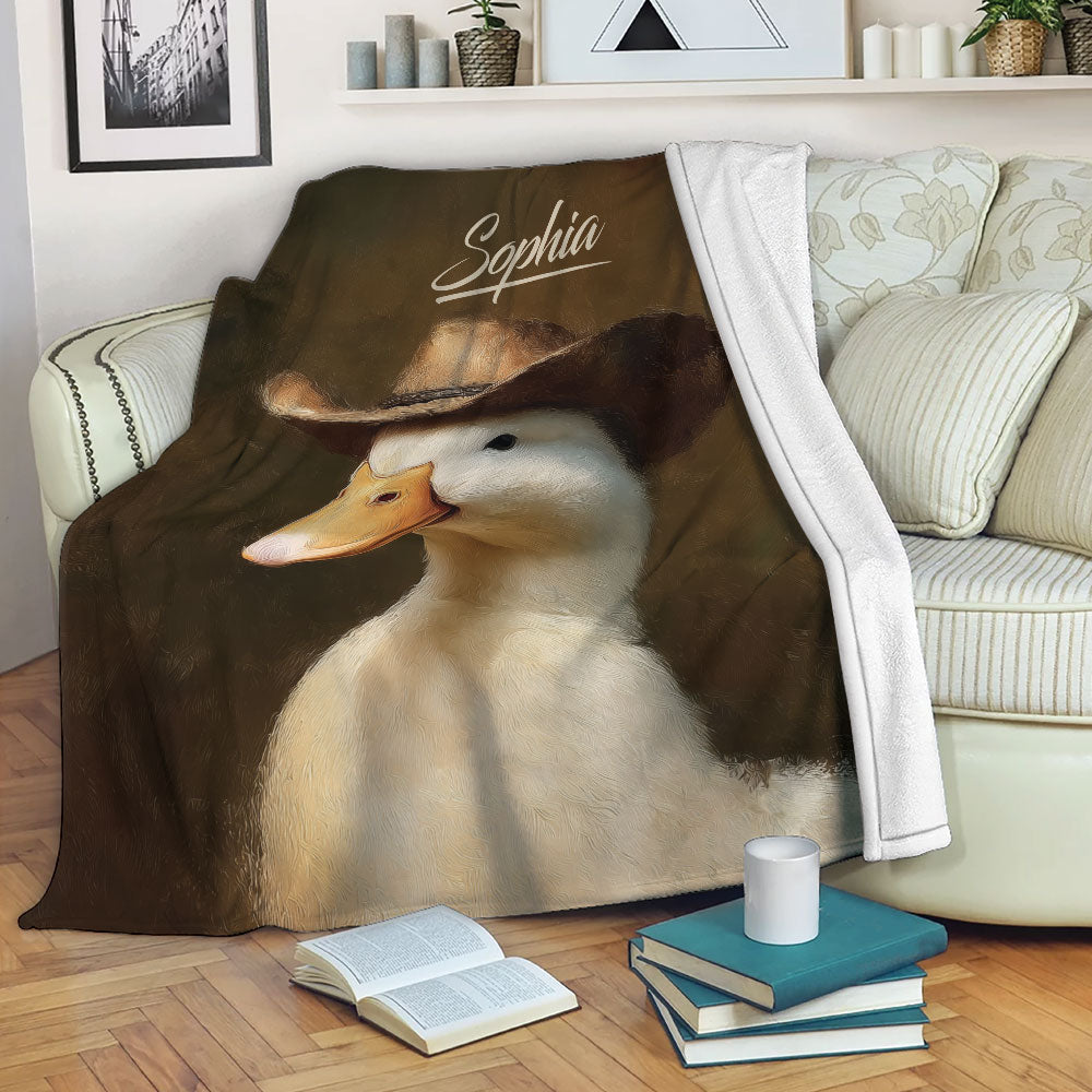 Cowboy duck throw blanket draped over a sofa in a cozy living room setting