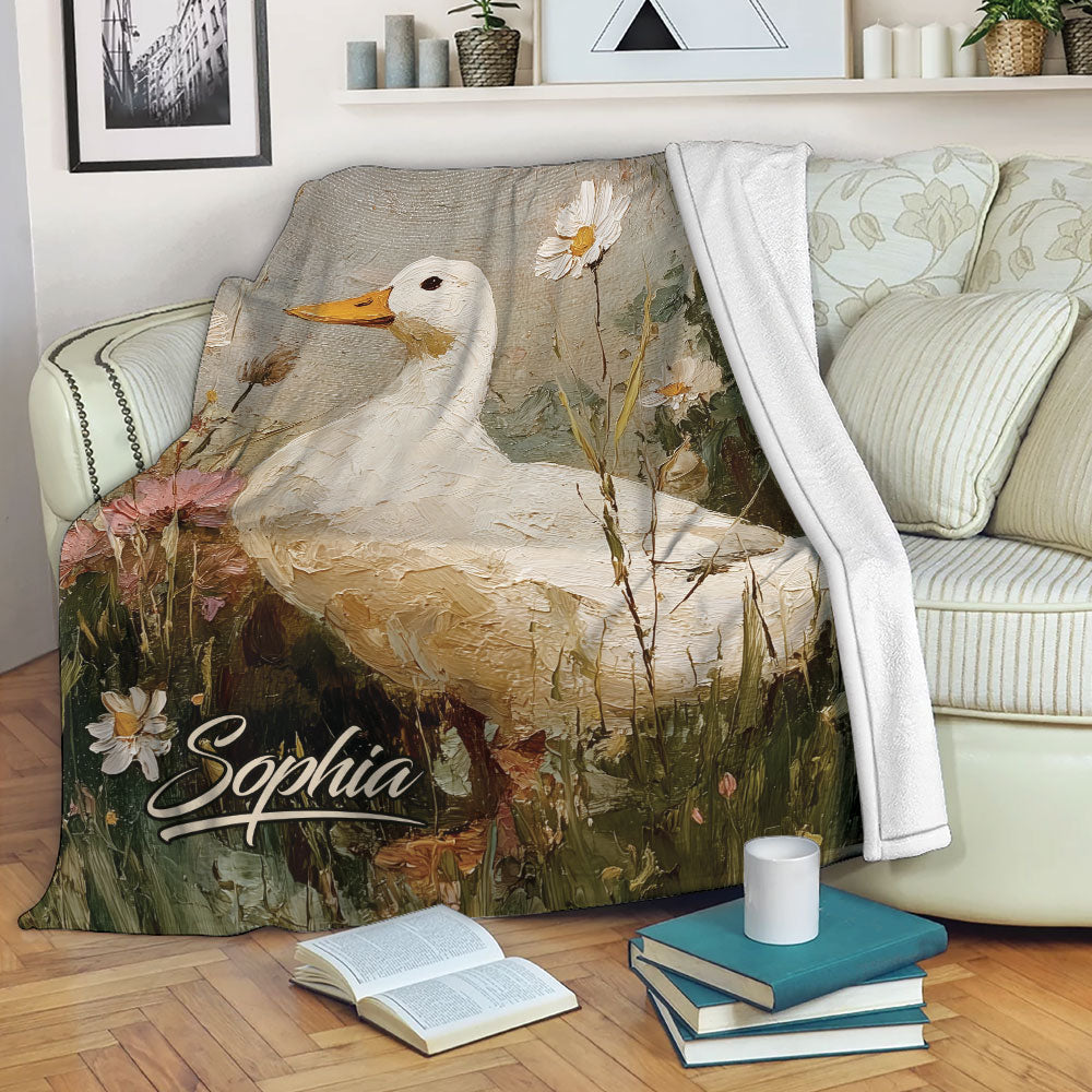 Duck blanket draped over a sofa with floral meadow artwork and rustic colors