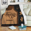 Texas throw blanket draped over a sofa with rustic western artwork and Southwestern cowboy theme