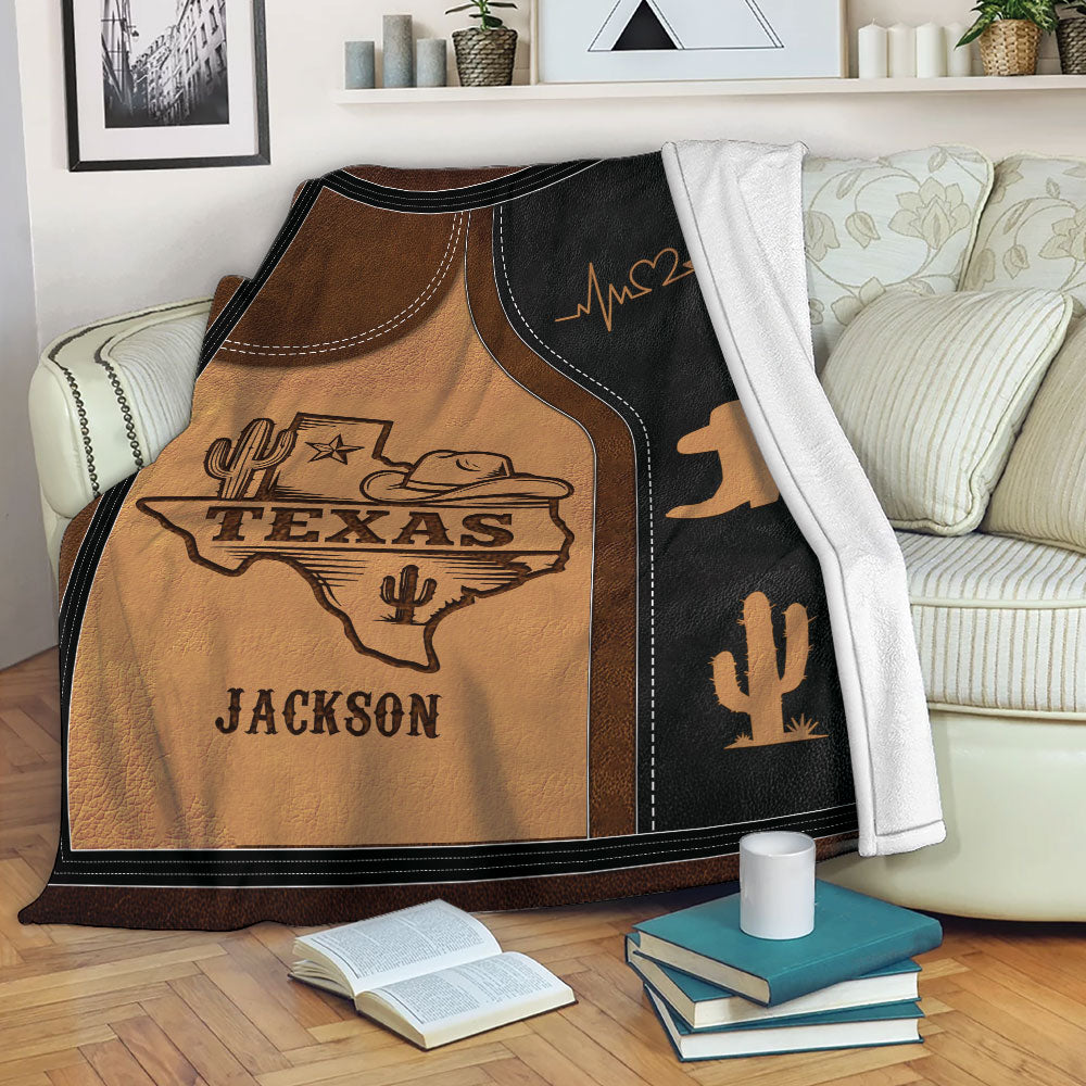 Texas throw blanket draped over a sofa with rustic western artwork and Southwestern cowboy theme