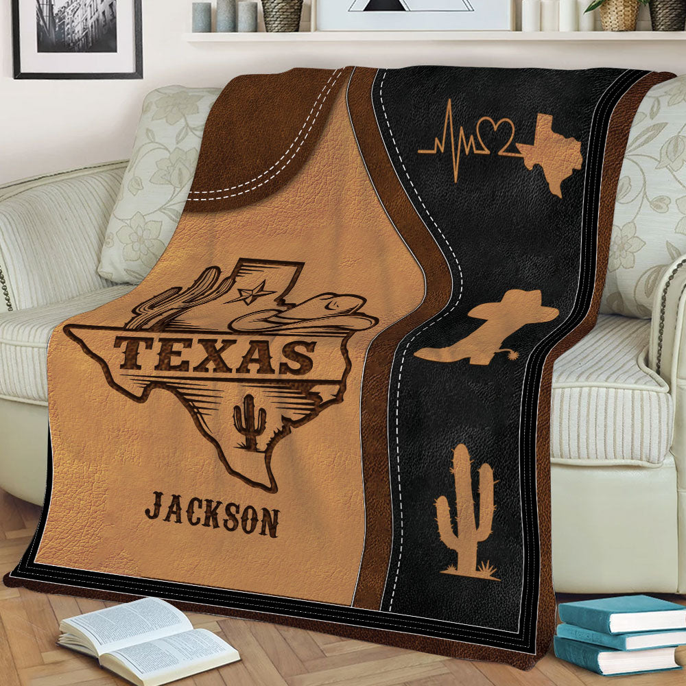 Rustic Texas blanket displayed on a sofa with cowboy, cactus, Lone Star, and western state artwork