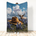 Custom Texas blanket with longhorn, cowboy hat, bluebonnets, and dramatic blue sky artwork
