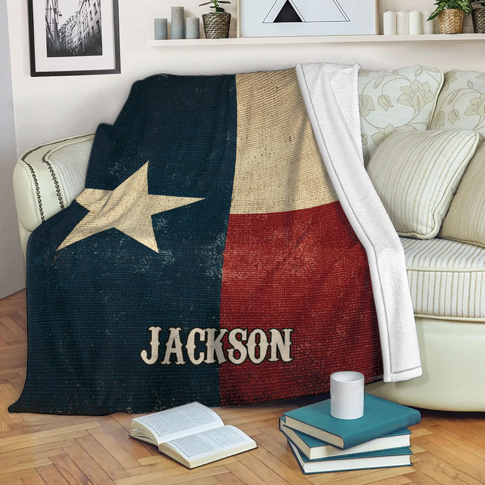 Texas flag throw blanket with Lone Star artwork draped over a sofa