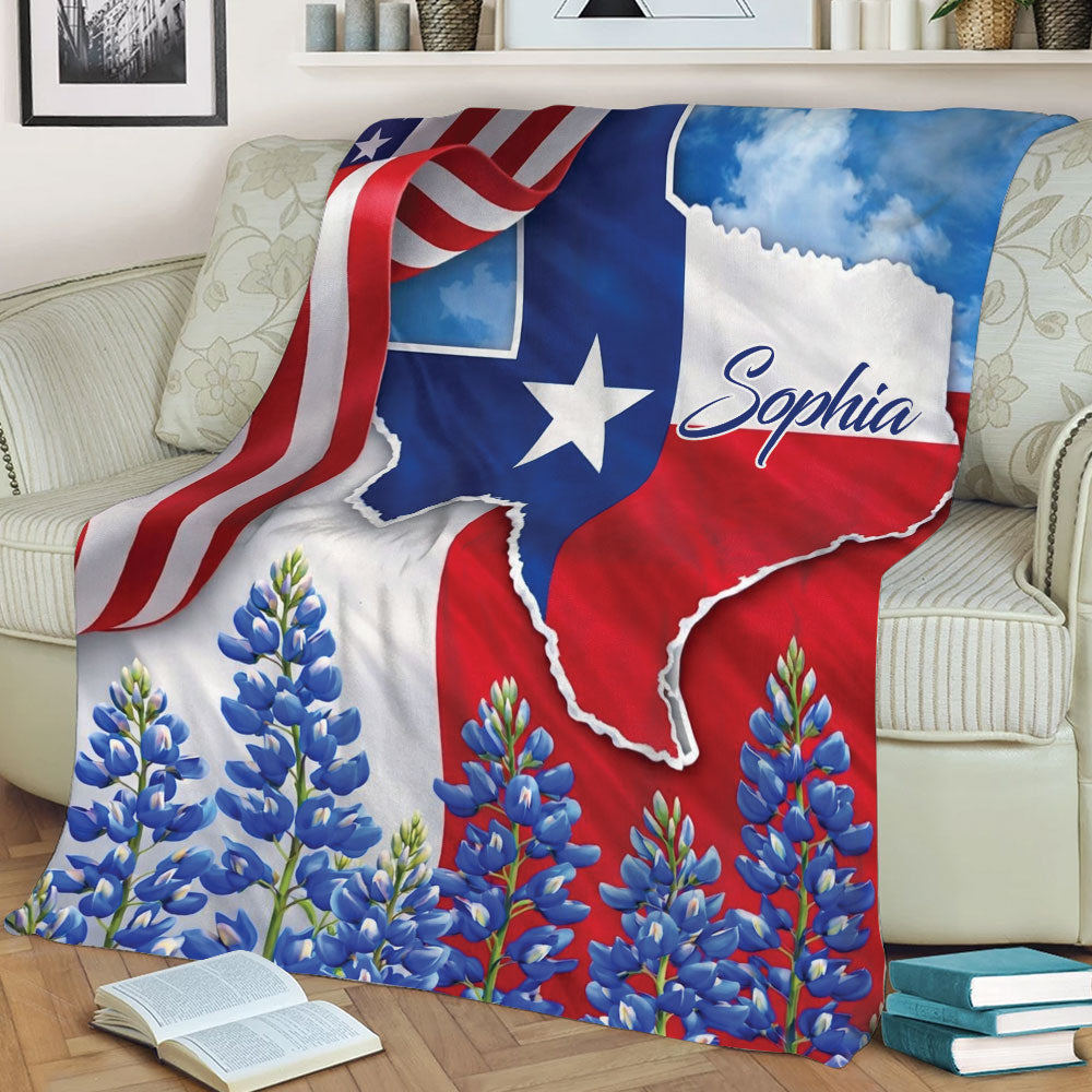 Texas blanket draped over a couch with Texas flag colors, Lone Star artwork, and bluebonnet flowers