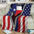 Texas pride throw blanket draped over a couch with American flag stripes and star details