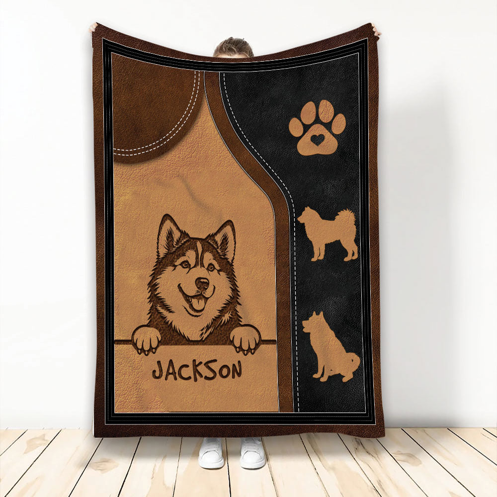 Alaskan Malamute blanket featuring a smiling dog illustration, paw print, and brown and black rustic artwork