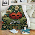 Ladybug blanket featuring a red beetle among flowers and leafy botanical artwork on a sofa