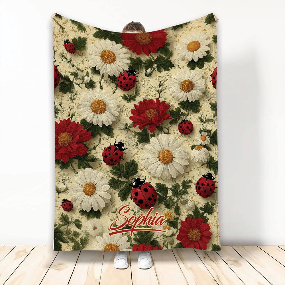 Ladybug throw blanket with red and white flowers, green foliage, and a garden-inspired pattern