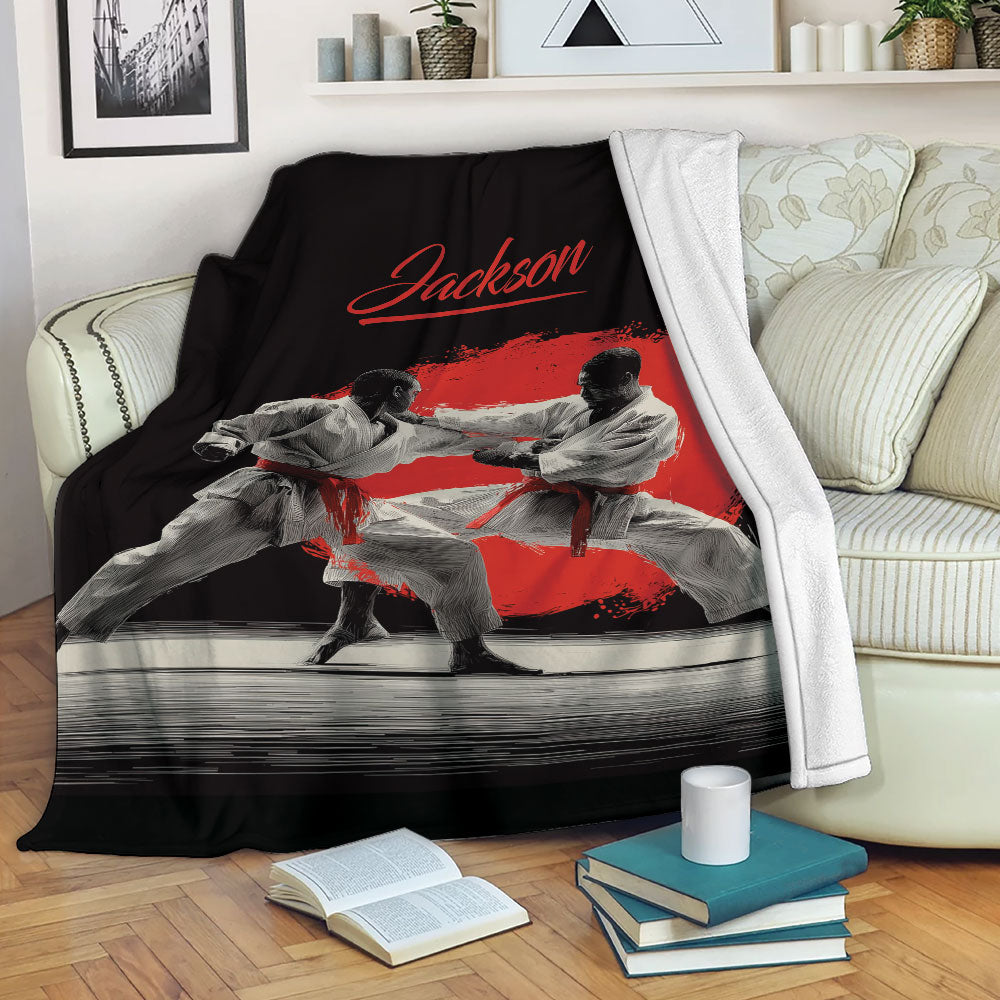 Karate blanket draped over a sofa, featuring martial artists in white uniforms and dramatic red artwork