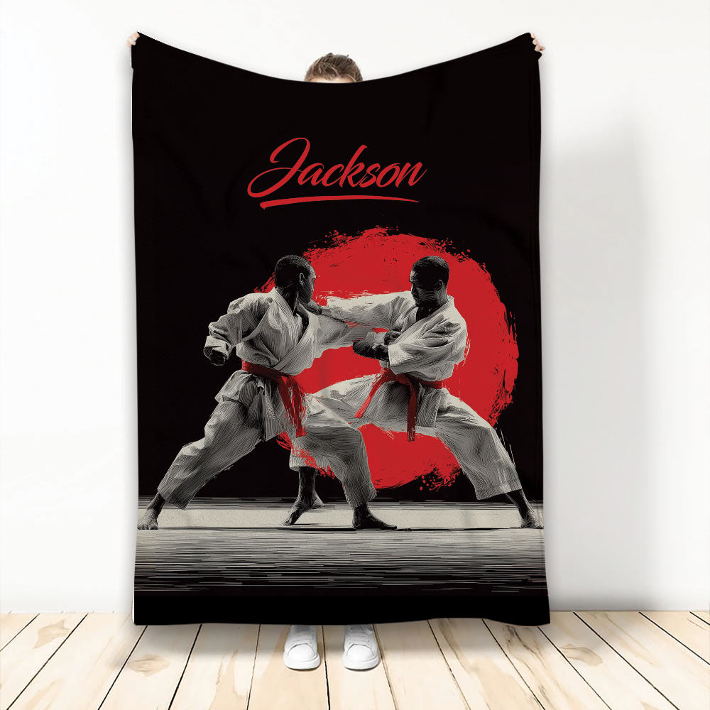 Karate throw blanket with two martial artists practicing strikes against a bold red and black background