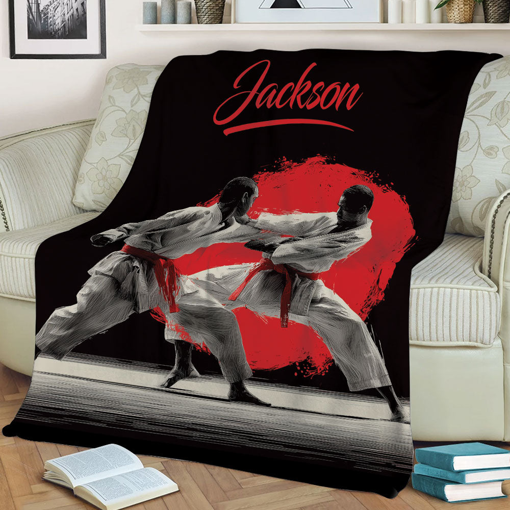 Black karate throw blanket displayed on a couch with dynamic martial arts training artwork