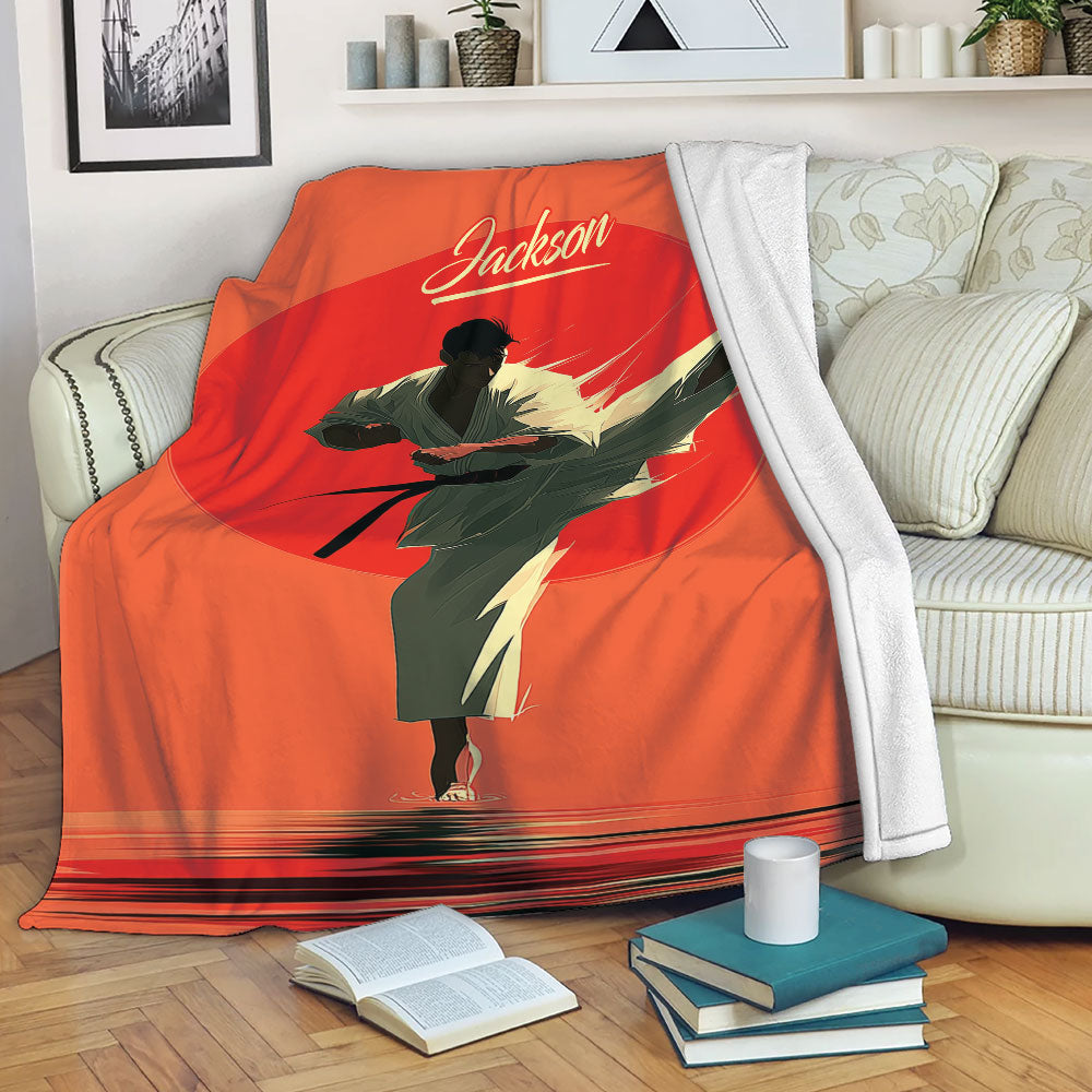 Karate throw blanket draped over a sofa with illustrated martial arts artwork in red and orange