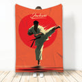 Karate throw blanket featuring a dynamic martial artist kicking across bold red and orange artwork