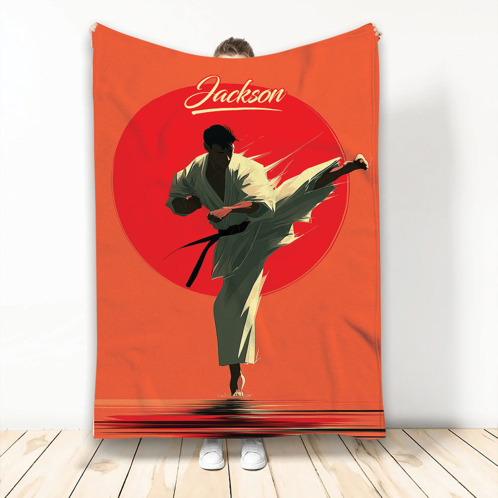 Karate throw blanket featuring a dynamic martial artist kicking across bold red and orange artwork