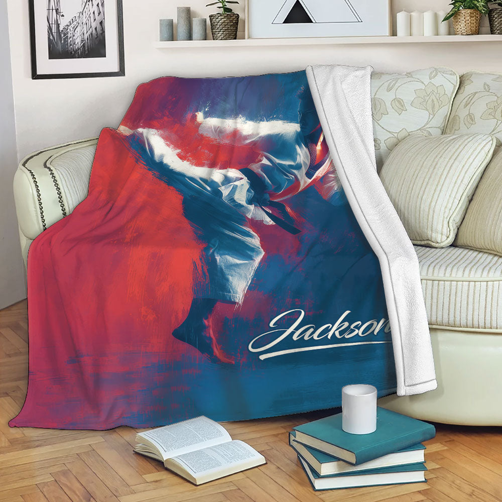 Karate blanket draped over a sofa with dynamic martial arts artwork in red, white, and blue