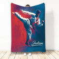 Karate throw blanket featuring a martial artist performing a high kick in bold red and blue artwork