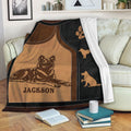 Dutch Shepherd blanket displayed on a living room sofa with detailed dog artwork and warm brown and black tones