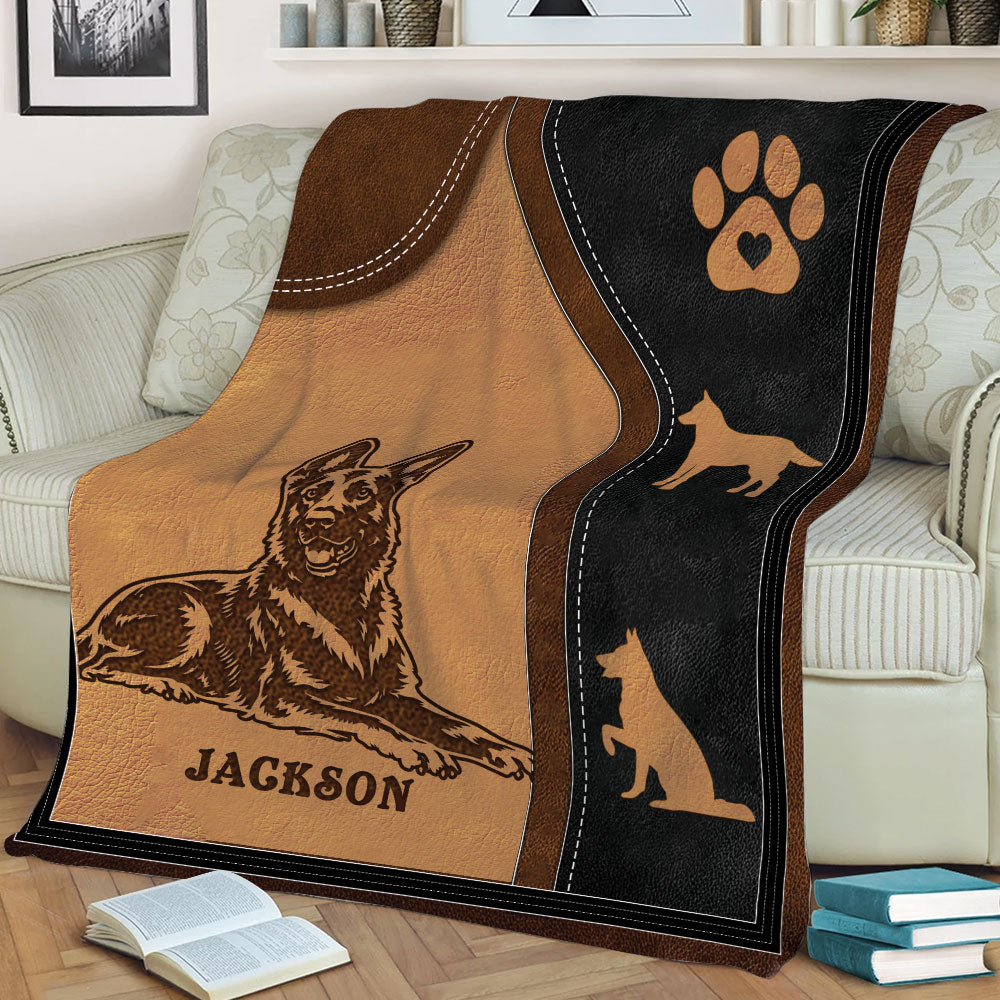 Dutch Shepherd throw blanket draped over a sofa, showing a detailed shepherd illustration and paw print design