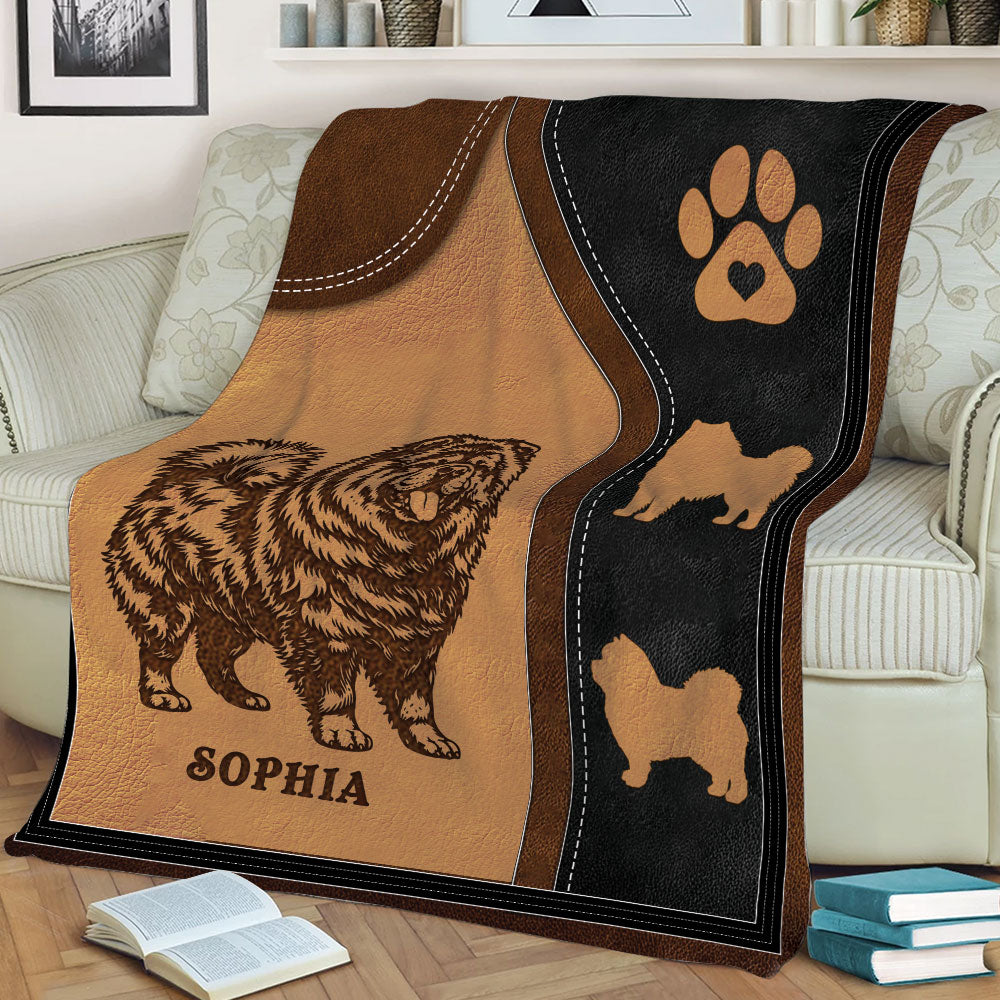 Close view of a Chow Chow throw blanket draped over a sofa in a warm brown and black design