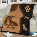 Close view of an American Bully throw blanket with dog silhouettes and paw print details