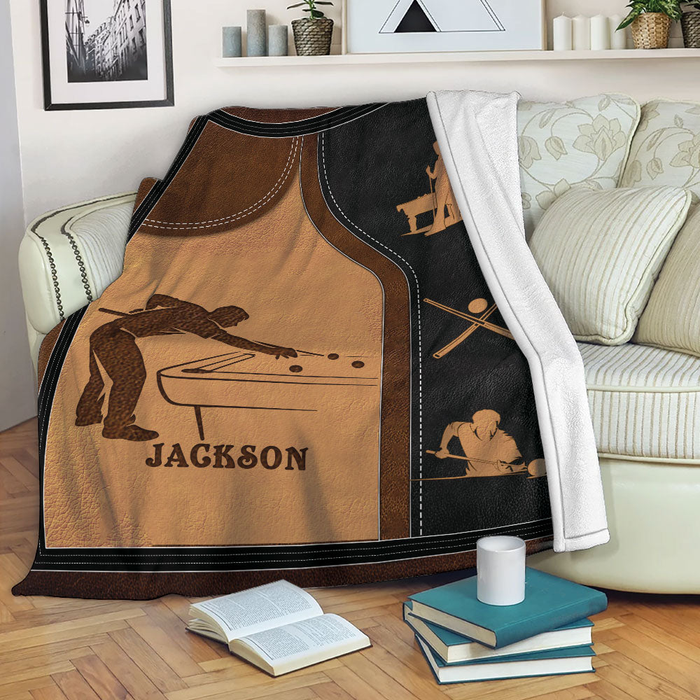Billiard blanket draped over a sofa, featuring pool table artwork and warm brown and black tones