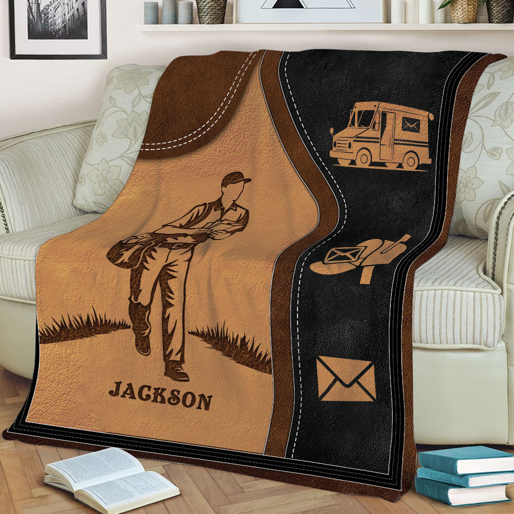 Custom mail carrier blanket draped over a sofa with postal truck, mailbox, and envelope artwork