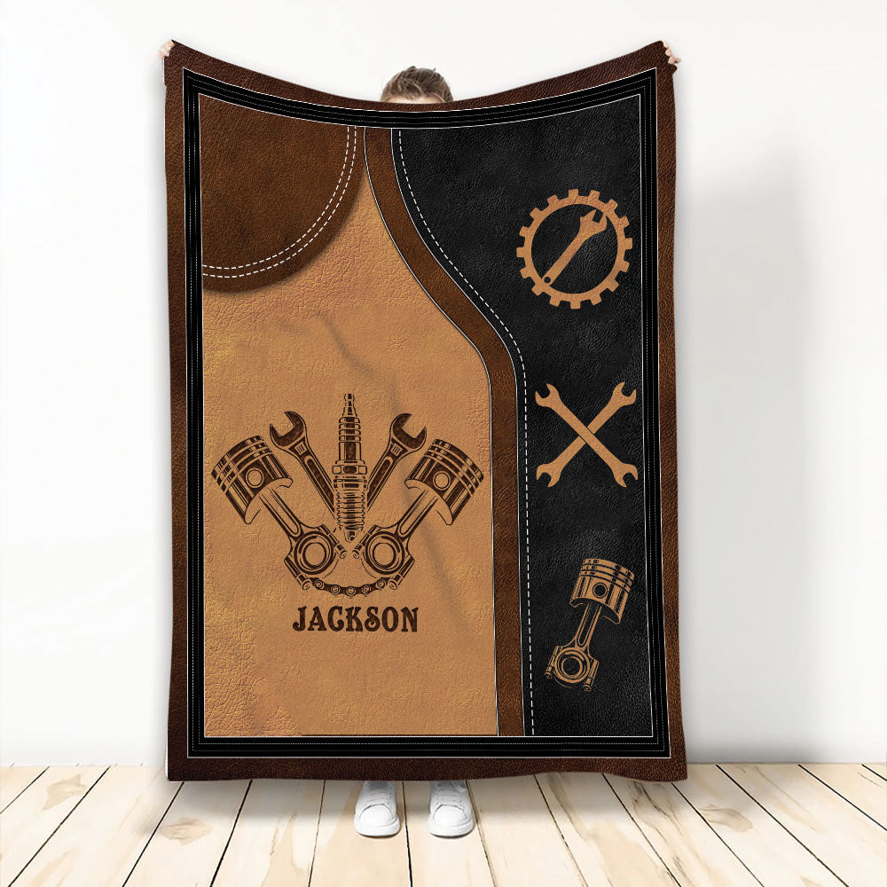 Mechanic throw blanket with pistons, crossed wrenches, spark plug, and vintage automotive repair artwork