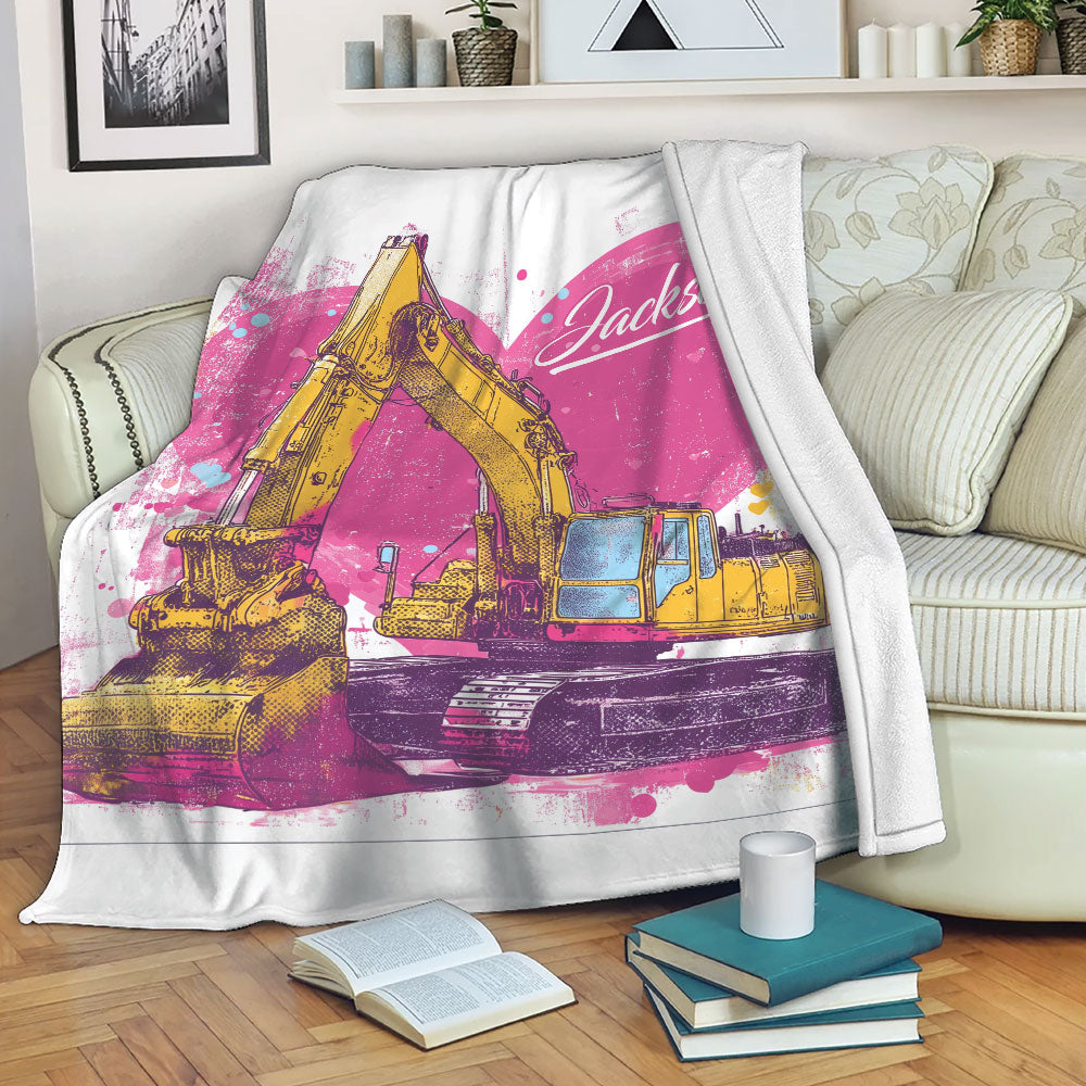 Excavator throw blanket displayed across a sofa with colorful construction vehicle artwork