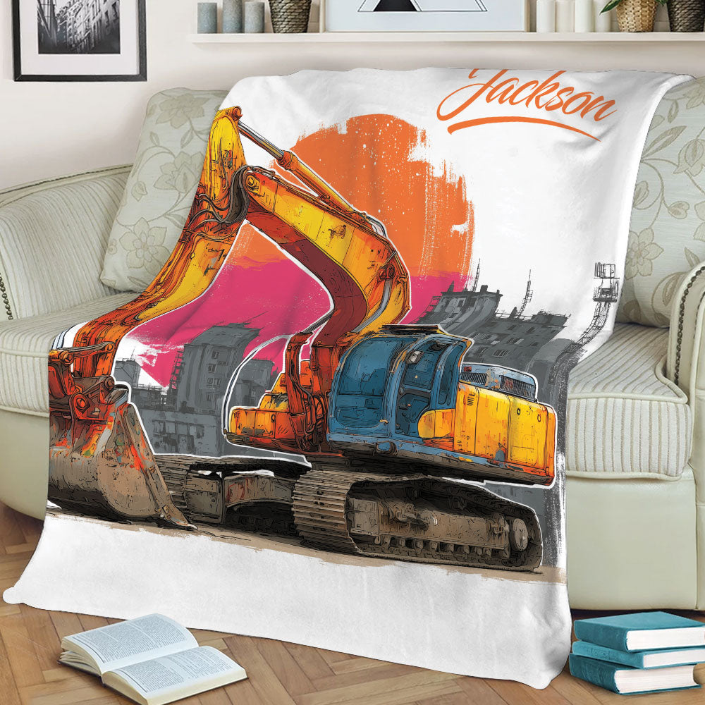 Close view of an excavator blanket draped over a sofa with bold industrial artwork