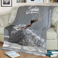 Close view of piano throw blanket artwork showing a pianist at a grand piano in an elegant room