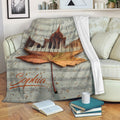 Piano throw blanket draped over a sofa with sheet music, piano keys, and autumn leaves