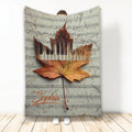 Piano throw blanket featuring piano keys, sheet music, and an autumn maple leaf design