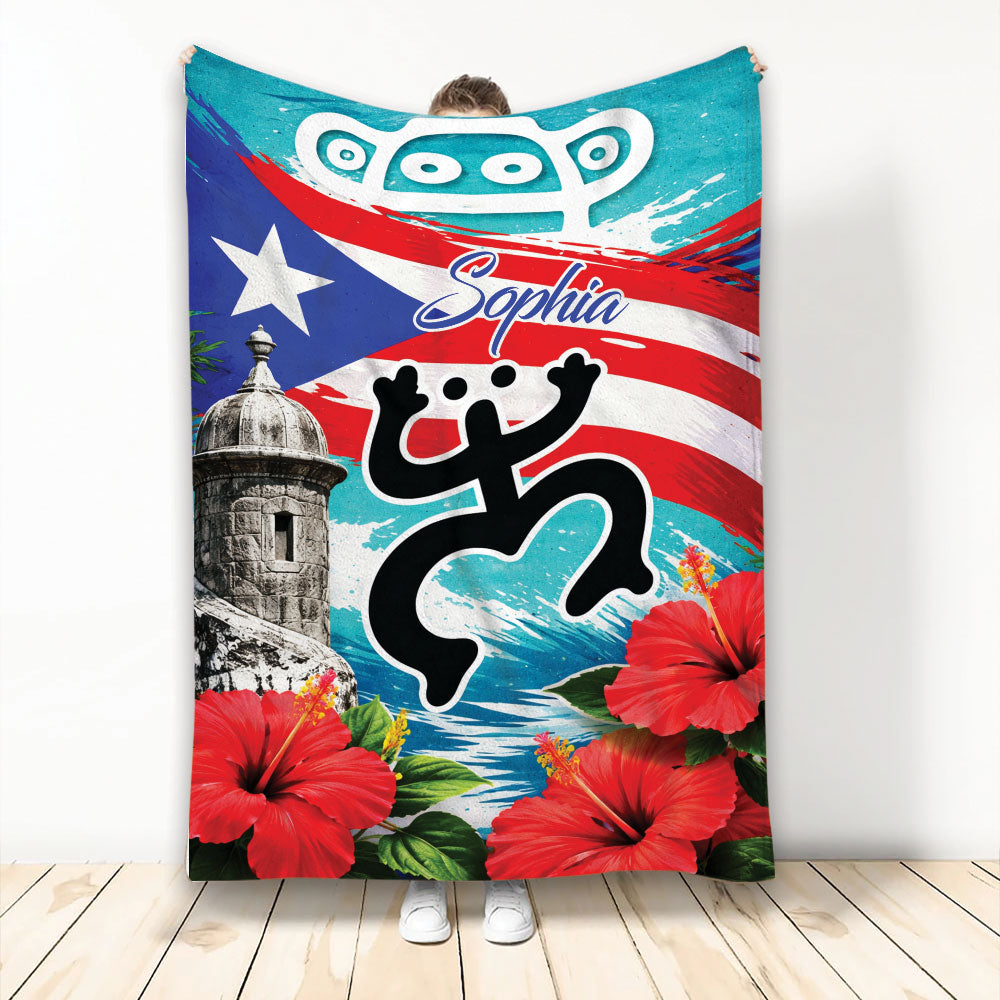 Puerto Rico blanket with flag artwork, coqui-inspired silhouette, historic fort, and red hibiscus flowers