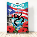Puerto Rico blanket with flag artwork, coqui-inspired silhouette, historic fort, and red hibiscus flowers