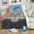 Puerto Rico throw blanket displayed on a sofa with bold cultural artwork in red, white, blue, and black