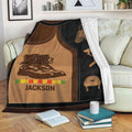 Vietnam Veteran blanket displayed on a couch with military boots, helmet, Vietnam map, and tribute artwork