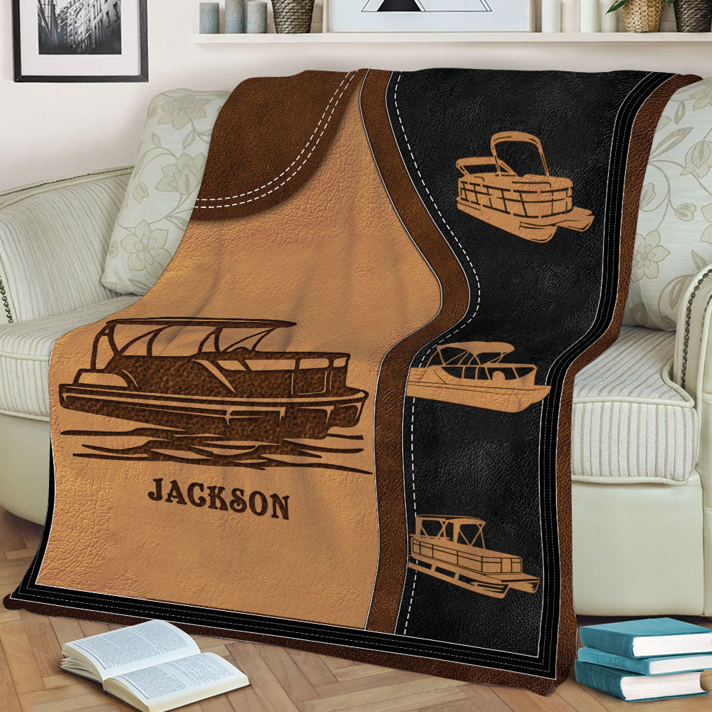 Pontoon boat blanket displayed on a sofa with multiple illustrated boats and a rustic design