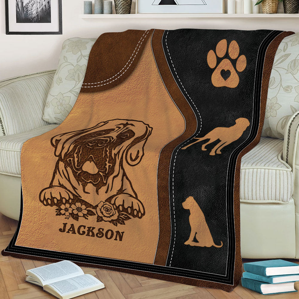 Close view of English Mastiff throw blanket artwork with paw print and dog silhouettes