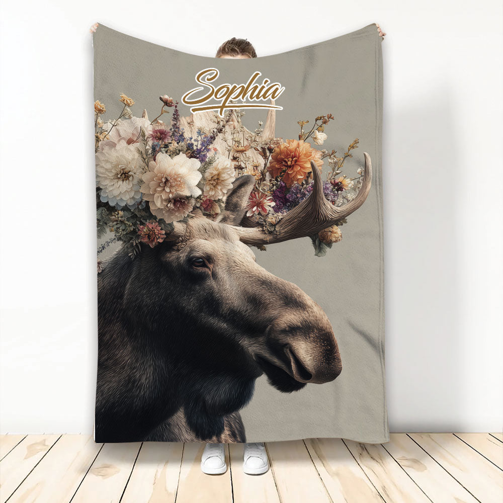 Moose blanket with floral antlers and custom artwork displayed against a neutral background
