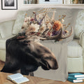 Close-up floral moose blanket featuring detailed antlers and wildlife artwork on a sofa