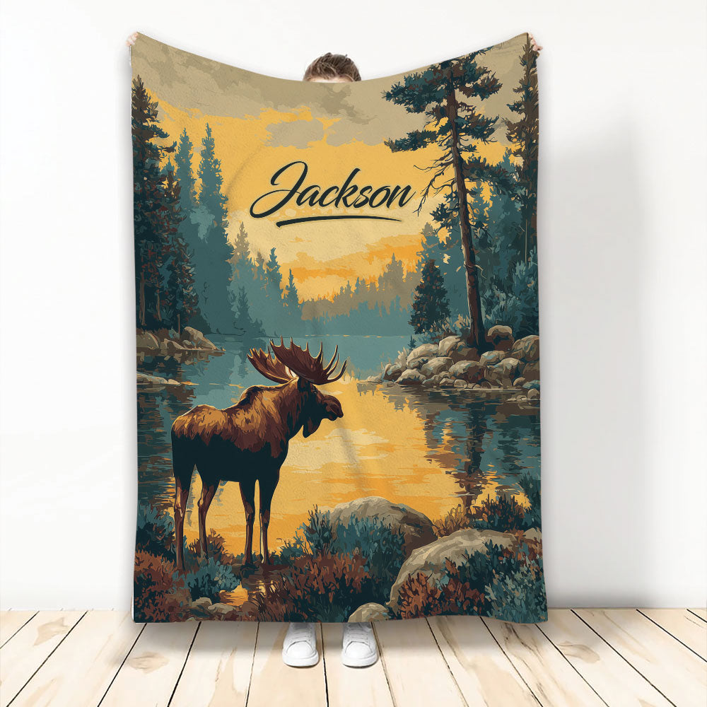 Moose throw blanket with a forest lake landscape, mountain wilderness colors, and bold custom artwork
