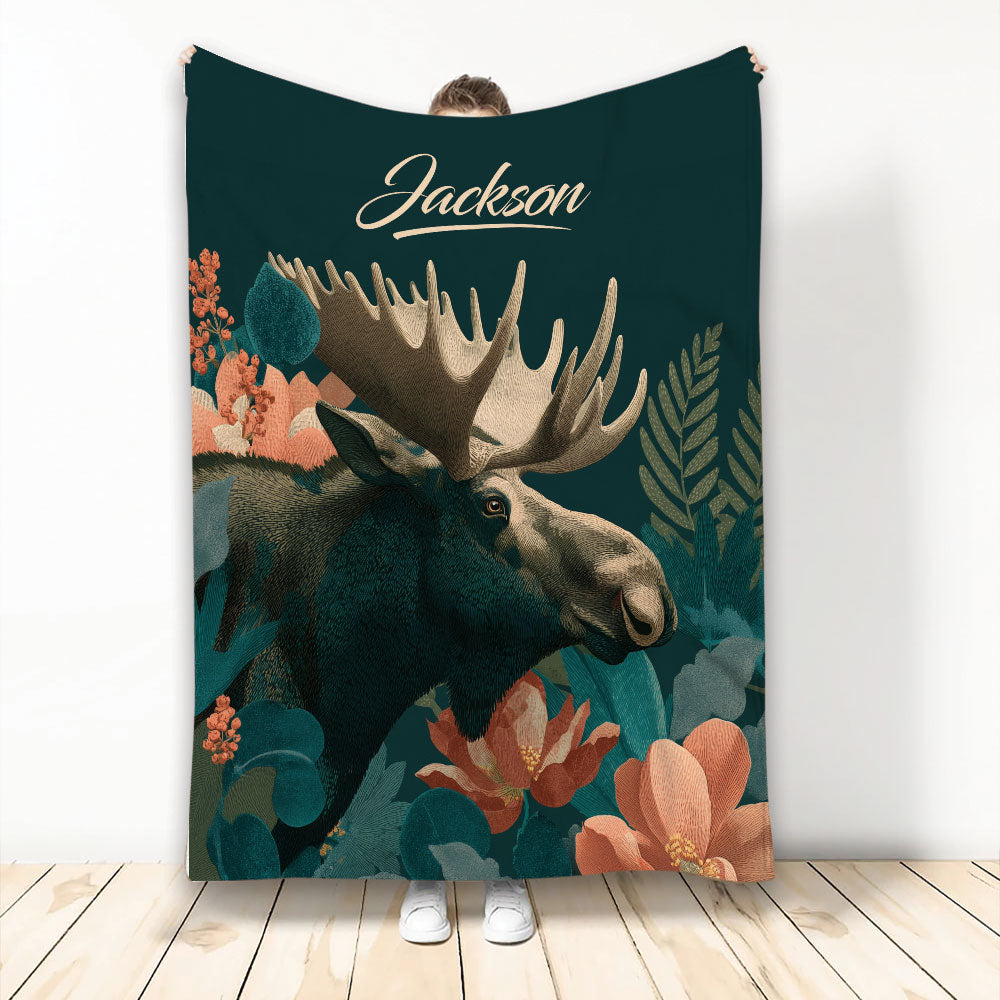 Moose throw blanket with large illustrated moose, woodland foliage, and warm floral accents