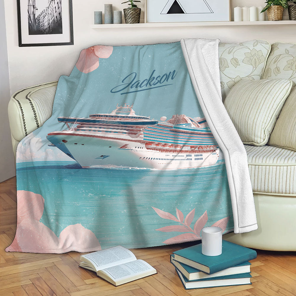 Cruise ship throw blanket displayed on a sofa with coastal artwork and a white plush back
