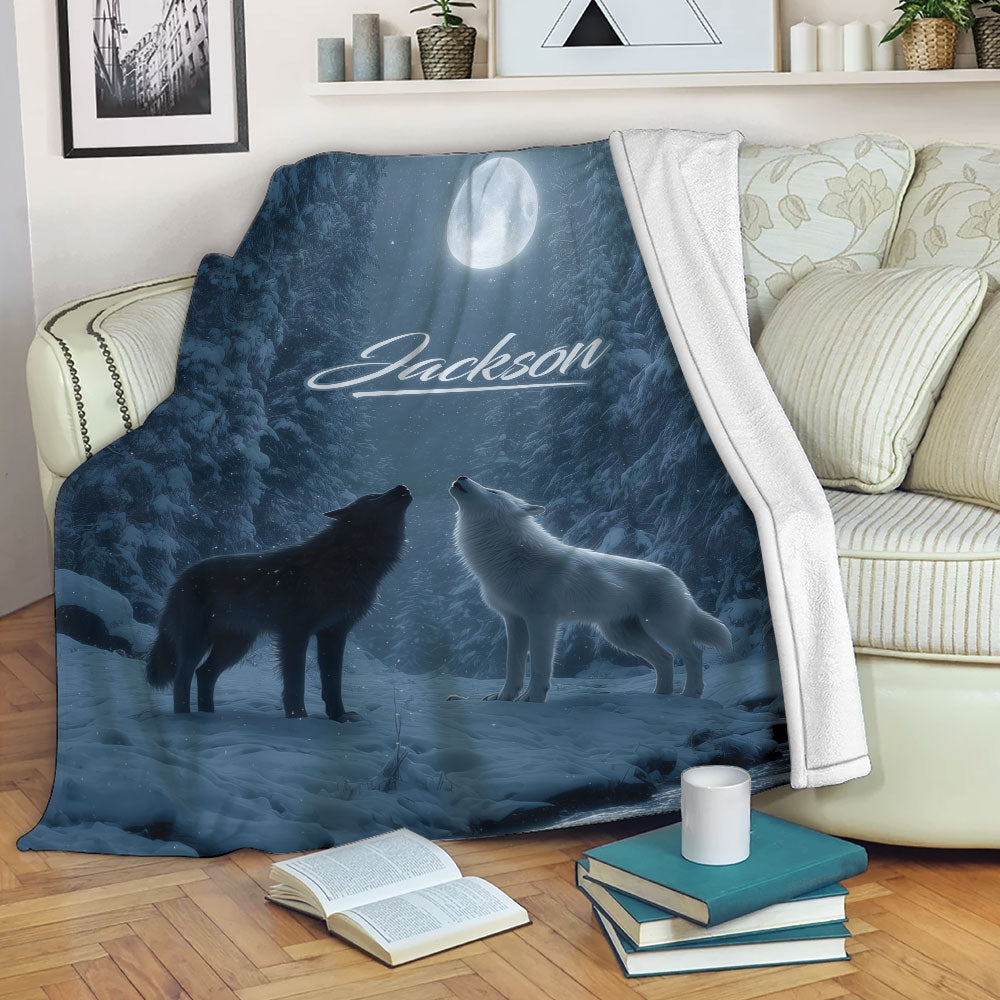 Wolf throw blanket draped over a sofa with moonlit forest artwork and two wolves
