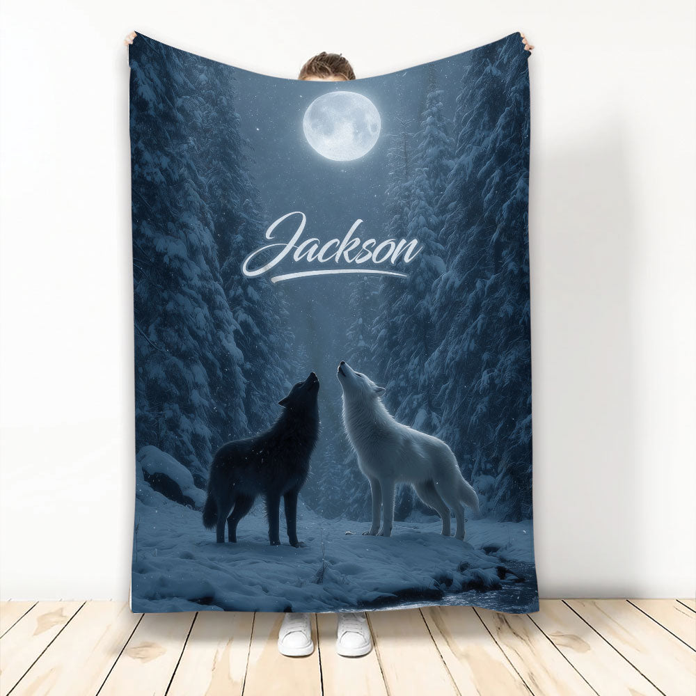 Moonlit wolf throw blanket displayed upright with two howling wolves in a snowy forest