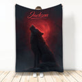 Wolf throw blanket featuring a howling wolf silhouette against a dramatic red moon and dark night sky