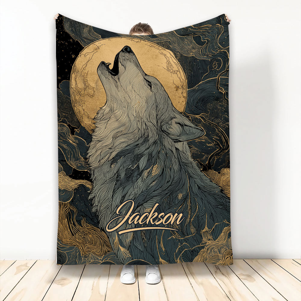 Howling wolf throw blanket with a golden moon, black background, and intricate line art