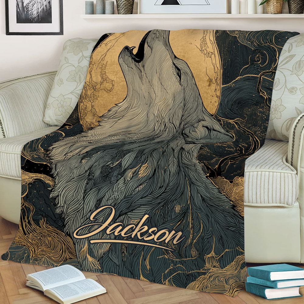 Close view of a howling wolf throw blanket featuring a large moon and flowing gold line patterns