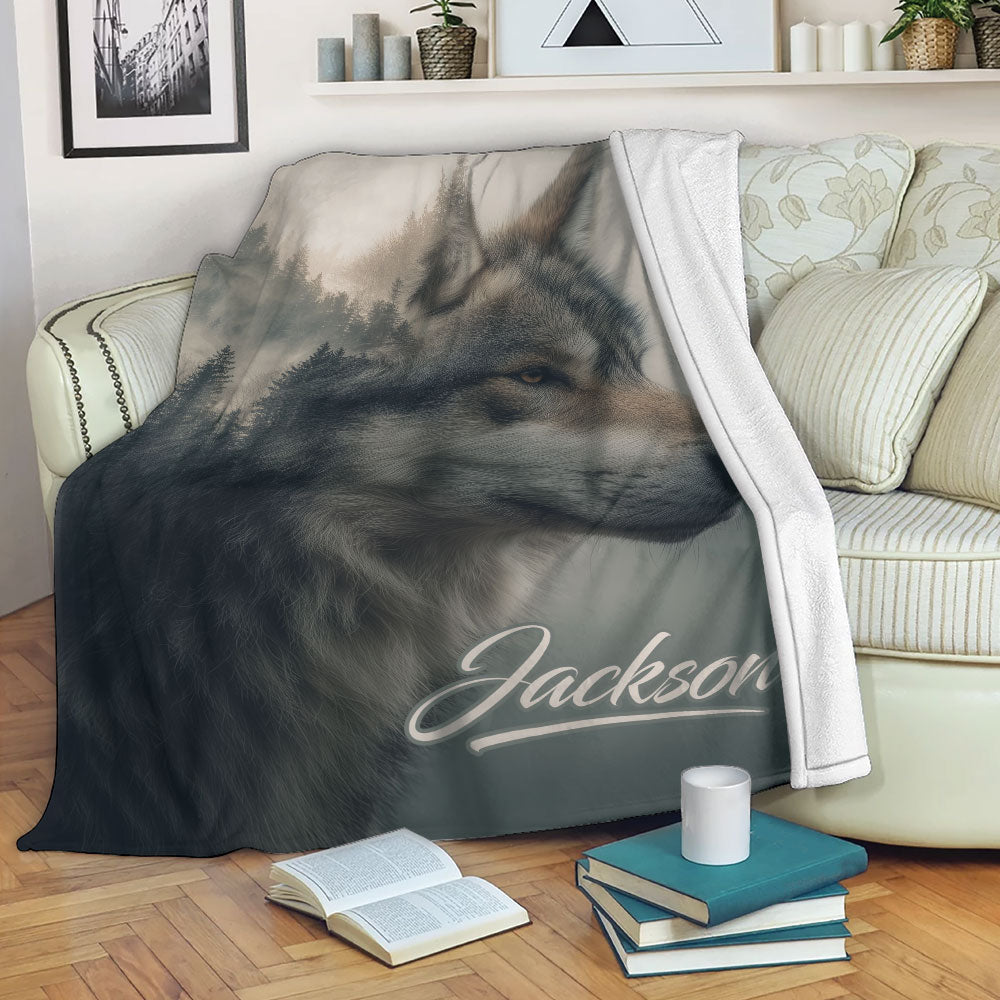 Wolf throw blanket draped over a sofa, showing a realistic woodland wolf portrait in muted colors