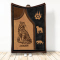 Tiger blanket with bold black and brown wildlife artwork, paw print, and animal silhouettes